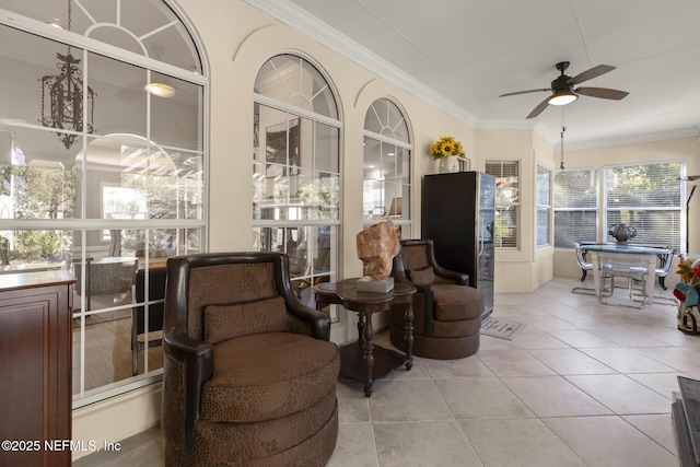 sunroom featuring ceiling fan