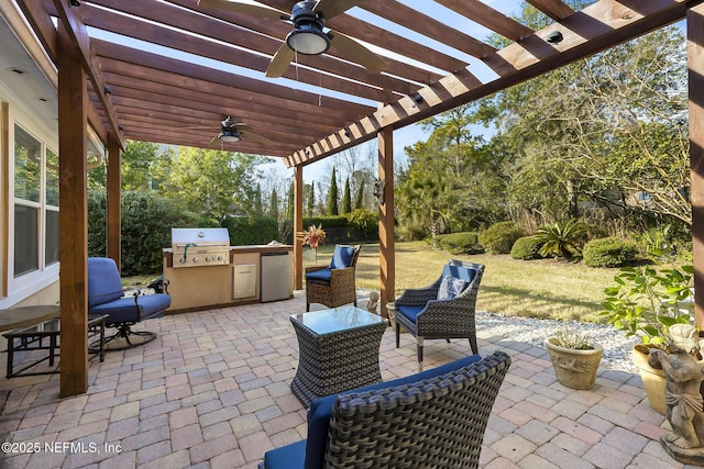 view of patio / terrace with ceiling fan, area for grilling, and a pergola