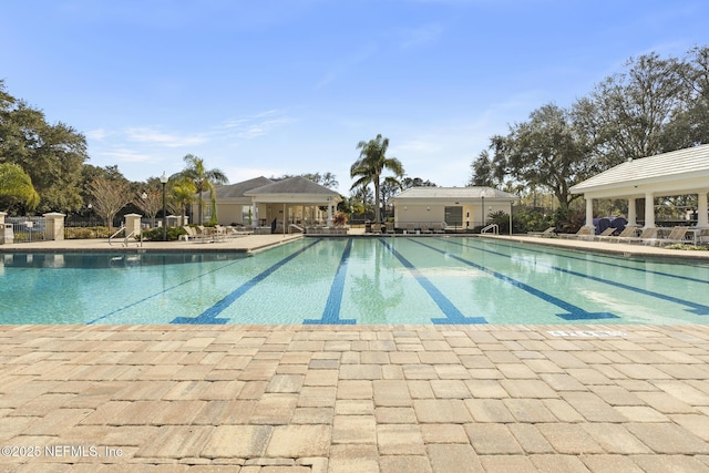 community pool featuring a patio area and a gazebo