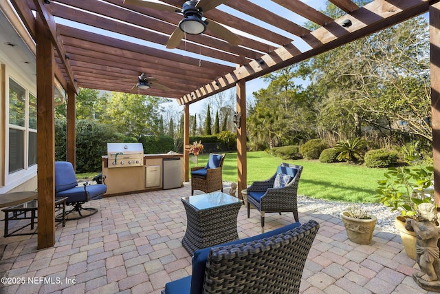 view of patio with a ceiling fan, grilling area, a pergola, and area for grilling