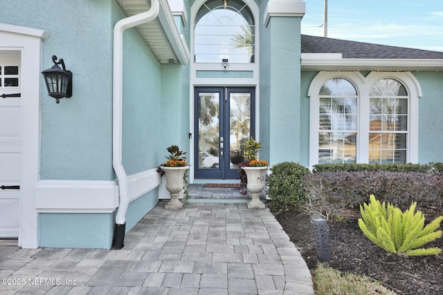 property entrance featuring french doors