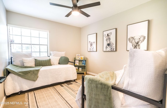 bedroom featuring wood-type flooring and ceiling fan