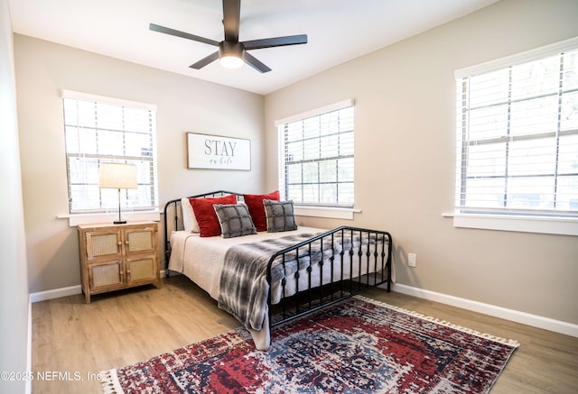 bedroom featuring ceiling fan and light hardwood / wood-style flooring