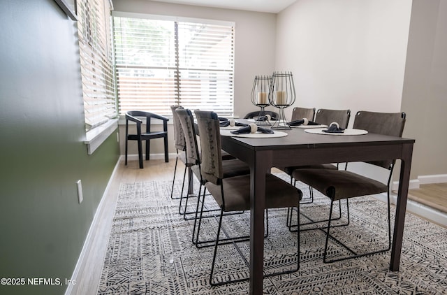 dining room with hardwood / wood-style flooring