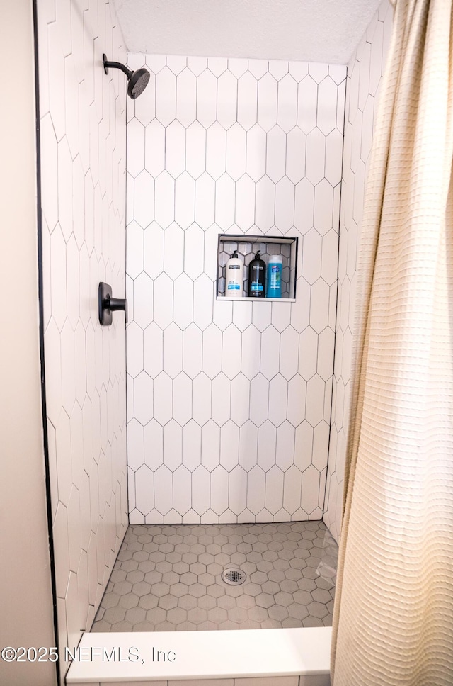 bathroom featuring curtained shower