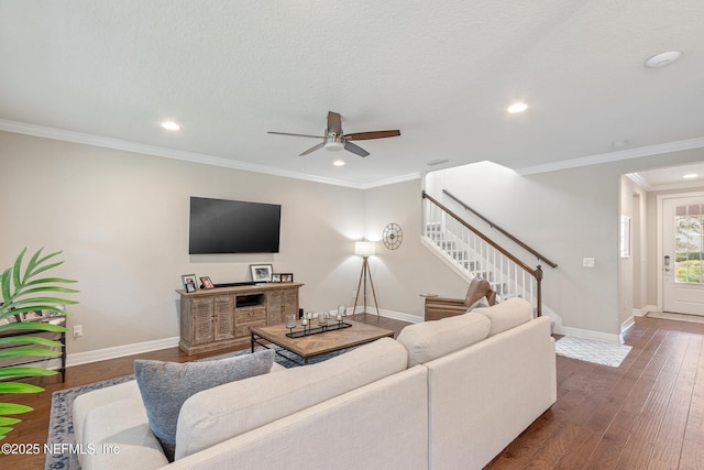 living room featuring crown molding, a textured ceiling, ceiling fan, and dark hardwood / wood-style flooring