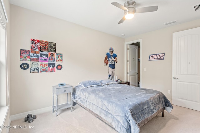 bedroom with light colored carpet and ceiling fan