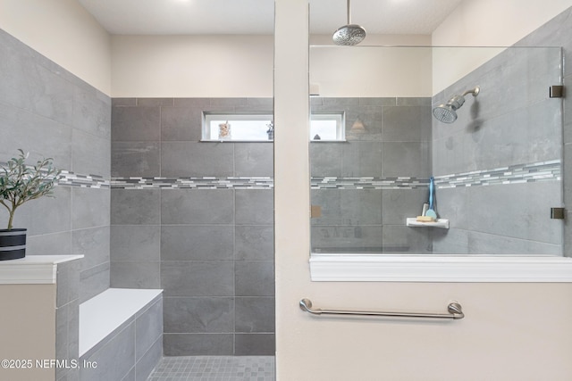 bathroom featuring a tile shower