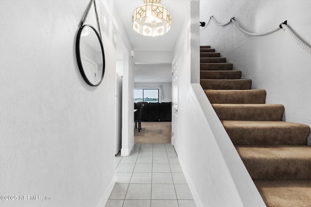 stairs featuring tile patterned flooring