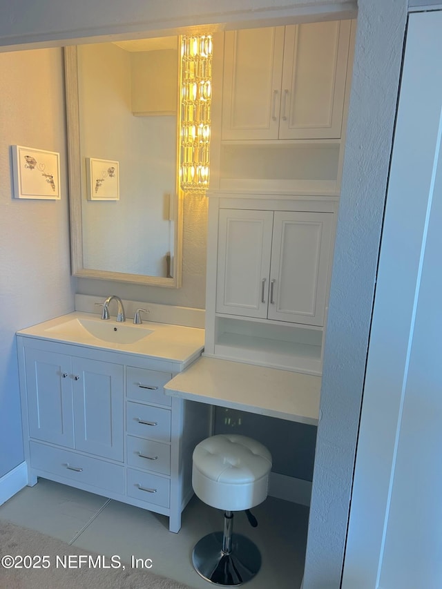 bathroom featuring tile patterned floors and vanity