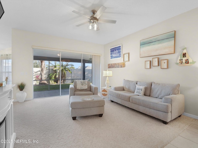 carpeted living room featuring ceiling fan