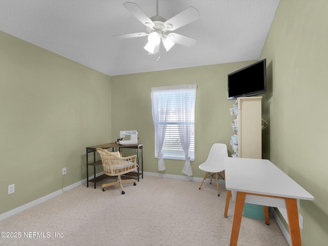 home office with light carpet and ceiling fan