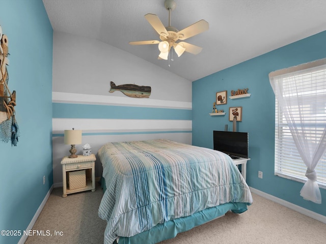 bedroom featuring lofted ceiling, ceiling fan, and carpet