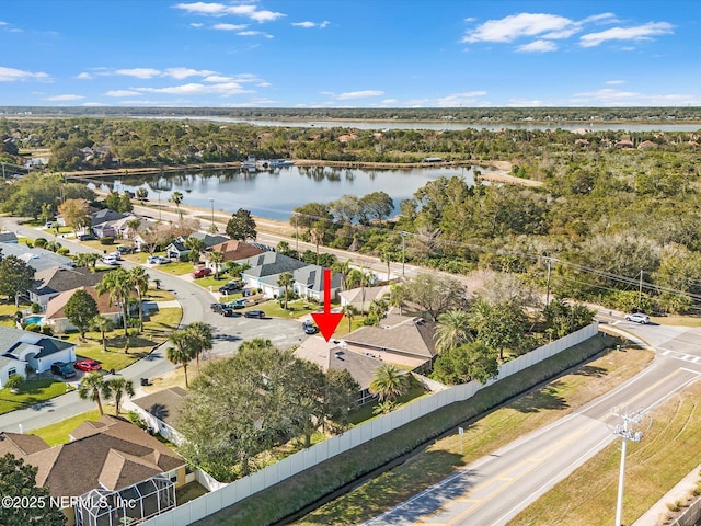 birds eye view of property with a water view