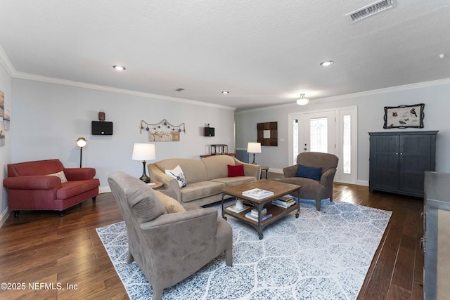 living room featuring crown molding, dark hardwood / wood-style flooring, and a textured ceiling