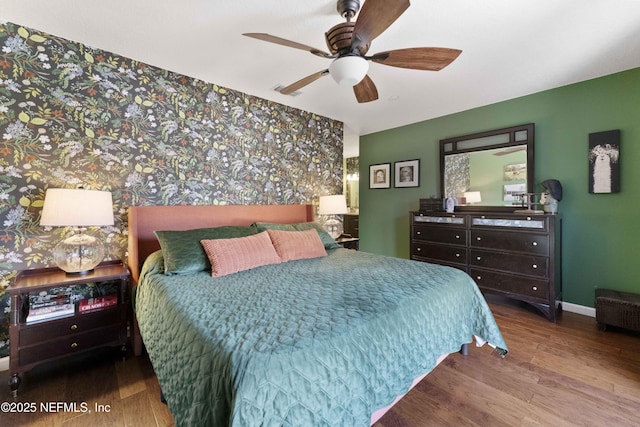 bedroom featuring hardwood / wood-style flooring and ceiling fan