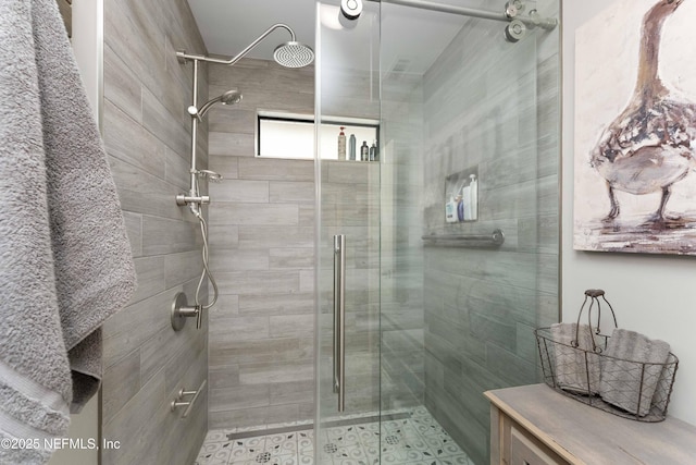 bathroom with a shower with shower door