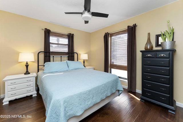 bedroom featuring dark wood-type flooring and ceiling fan