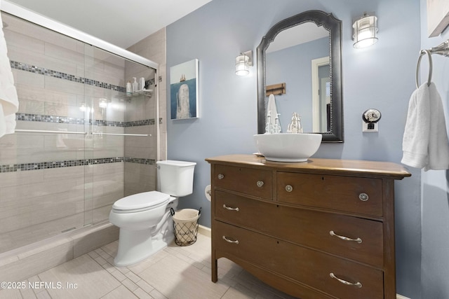 bathroom with vanity, an enclosed shower, tile patterned floors, and toilet