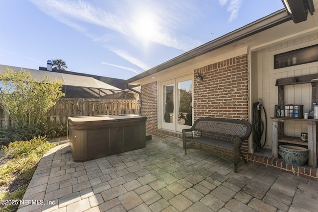 view of patio / terrace with a hot tub