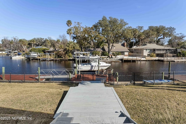 dock area featuring a yard and a water view