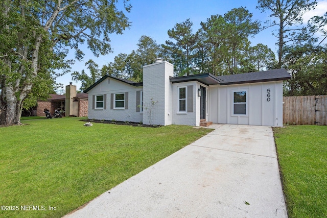 ranch-style home featuring a front yard