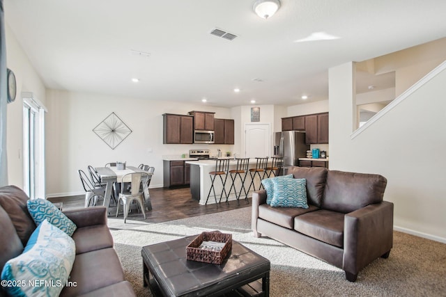 living room featuring dark hardwood / wood-style flooring