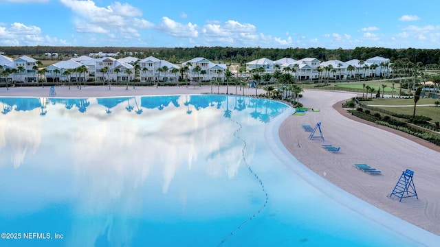 view of pool with a residential view