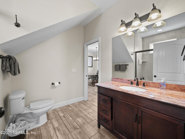 bathroom featuring vanity, toilet, and walk in shower