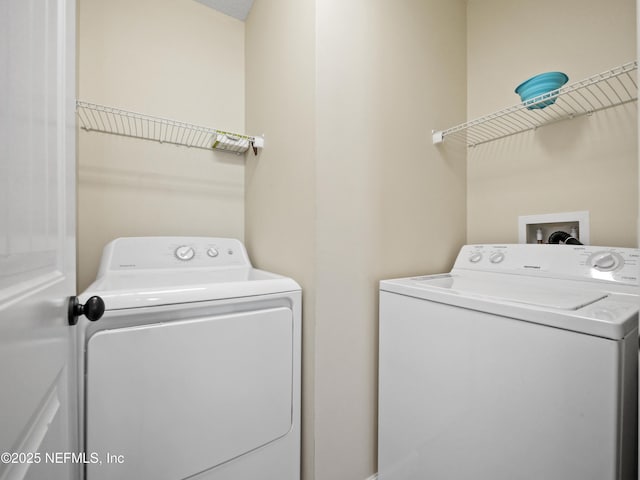 laundry area with separate washer and dryer