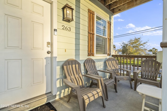 entrance to property featuring a porch