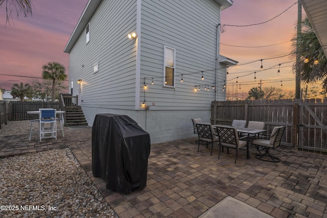 patio terrace at dusk with grilling area