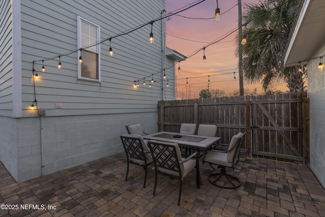 view of patio terrace at dusk