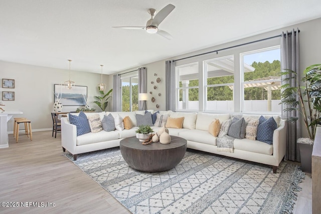 living room featuring hardwood / wood-style flooring and ceiling fan