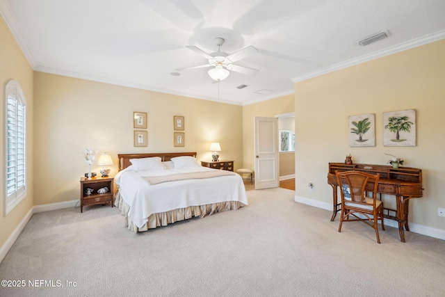 bedroom featuring ornamental molding, light colored carpet, and ceiling fan