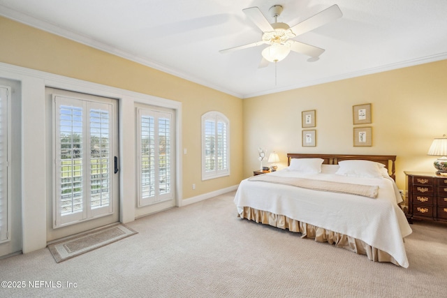 bedroom with ornamental molding, light carpet, multiple windows, and access to outside