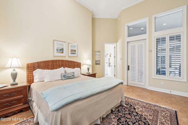 bedroom with crown molding, tile patterned floors, and access to exterior