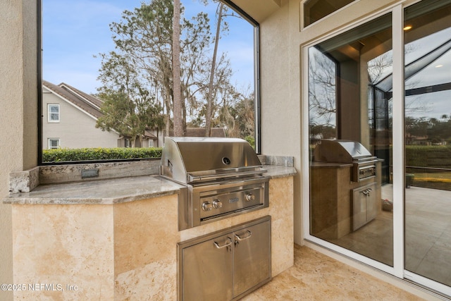 view of patio / terrace with an outdoor kitchen and grilling area