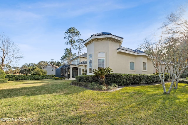 view of home's exterior featuring a lawn