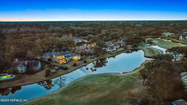 aerial view at dusk with a water view