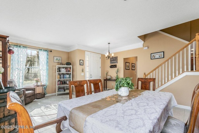 dining area with crown molding and a notable chandelier