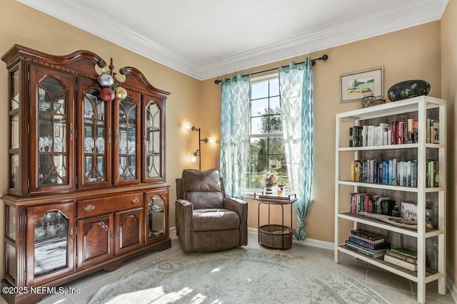 sitting room with crown molding and light tile patterned flooring