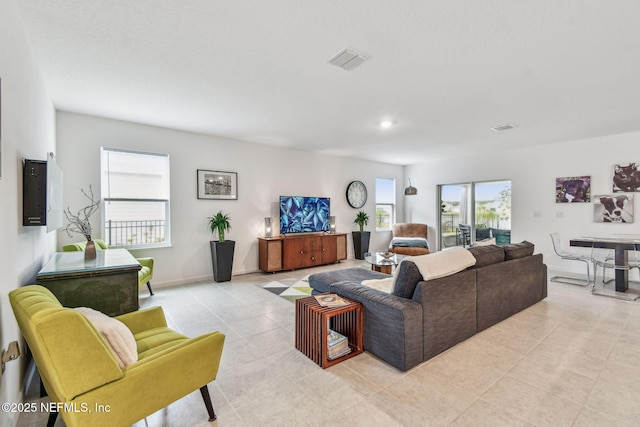 tiled living room with electric panel