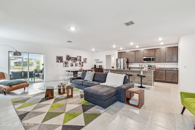 living room featuring light tile patterned floors