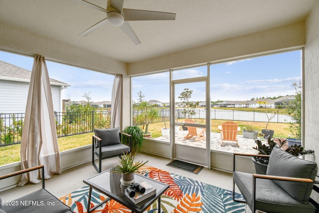 sunroom / solarium with ceiling fan and plenty of natural light