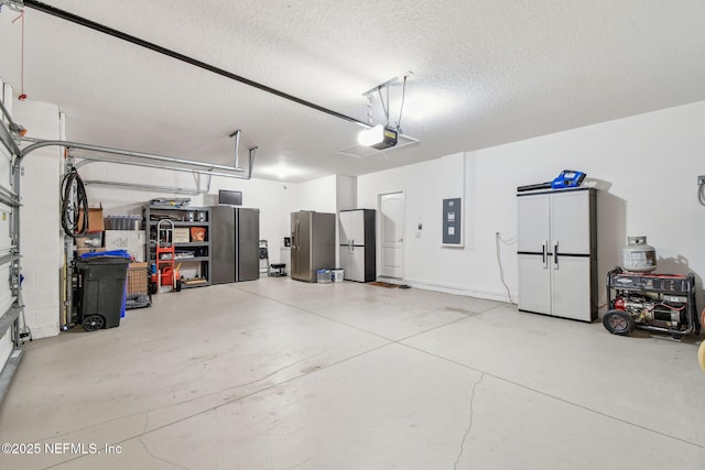 garage featuring refrigerator, a garage door opener, electric panel, and stainless steel refrigerator with ice dispenser