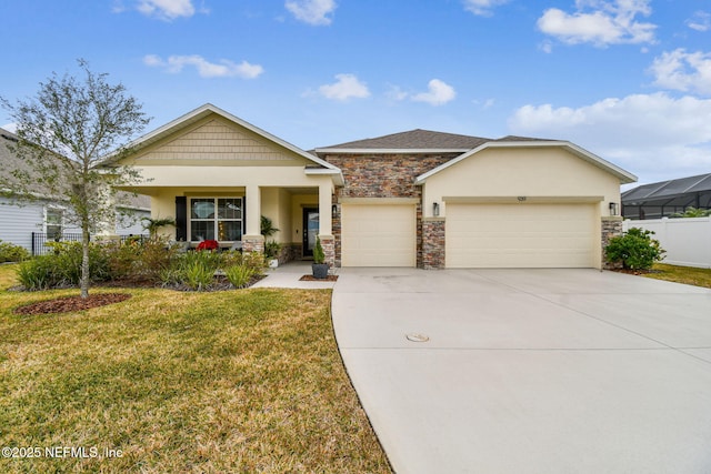 view of front of property featuring a garage and a front yard