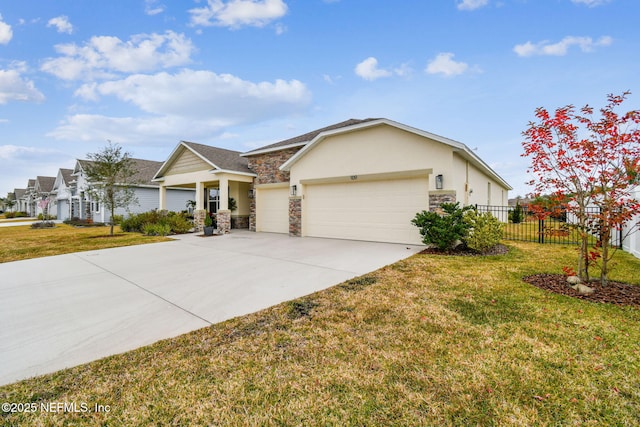 ranch-style home featuring a garage and a front lawn