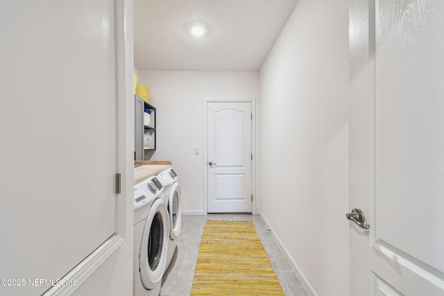 laundry area featuring washing machine and dryer