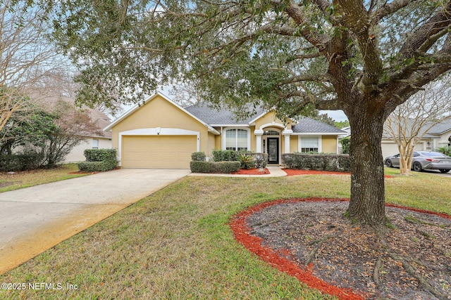 ranch-style home with a garage and a front lawn